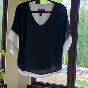 Frank Lyman black with white underlay silver trim on the sleeves size 8